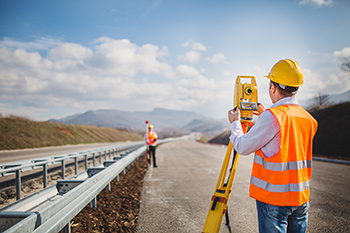 Construction worker using GIS tech